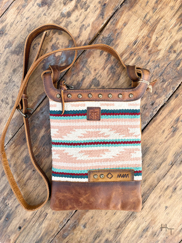 Photo of front of leather and pastel color aztec print woven fabric